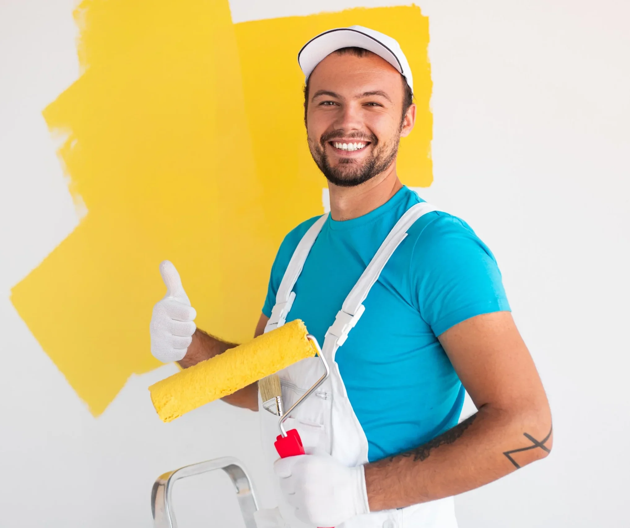 young male painter with roller giving-thumbs-up 4k